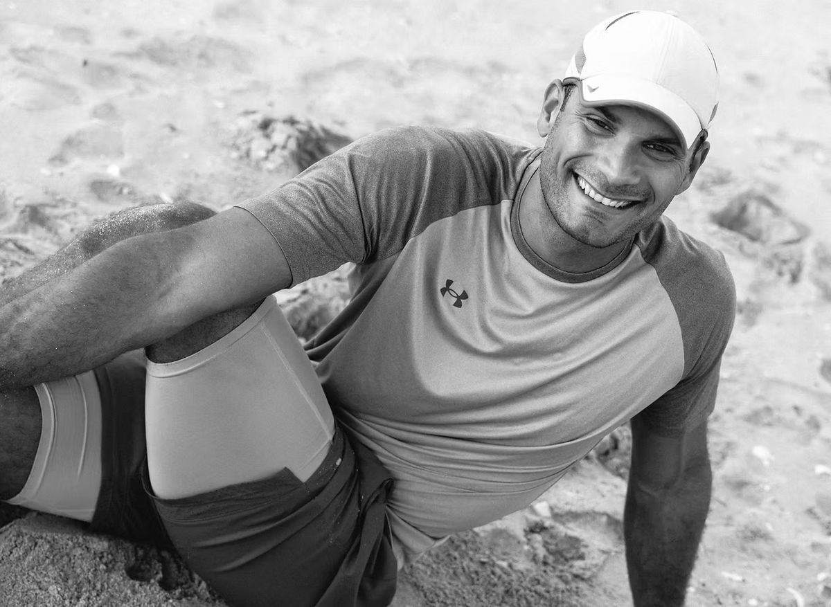 Brendan Webster, personal trainer in St. Maarten, smiling on the beach