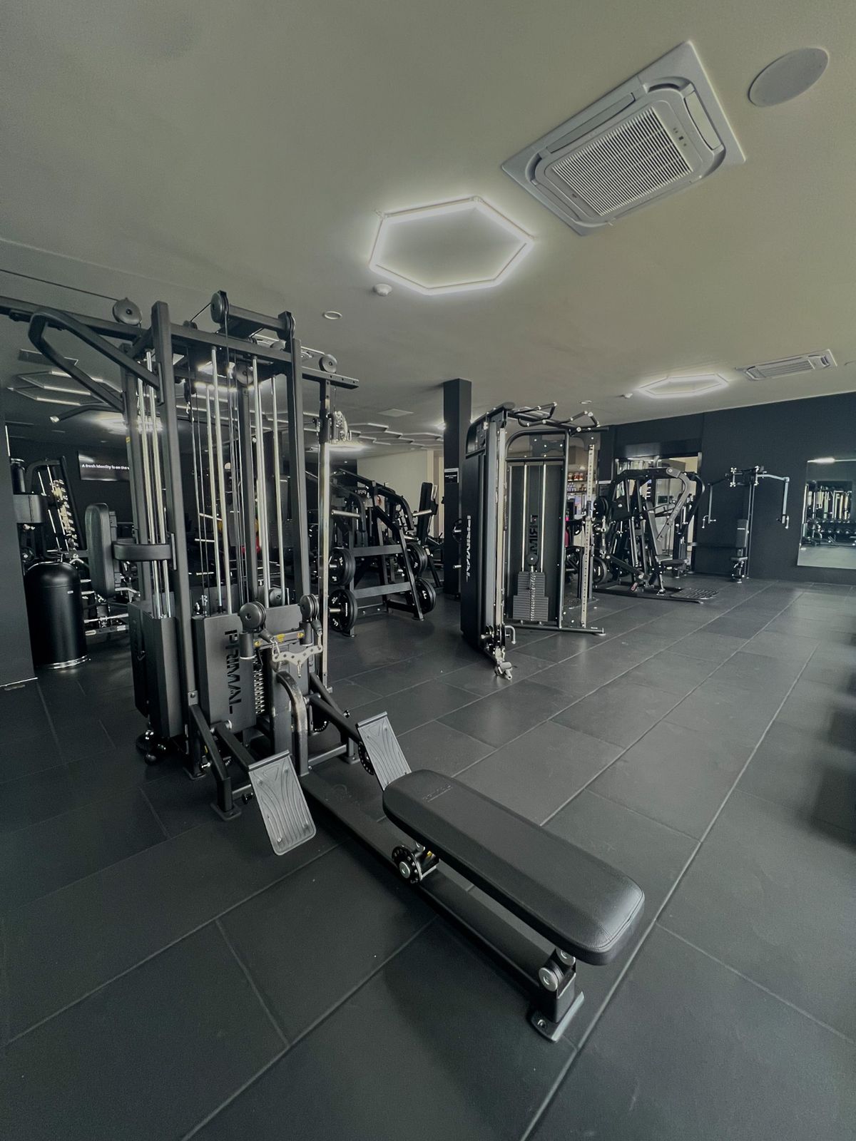 Multi-station cable machine and functional trainers